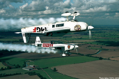 Flipping heck: John Miller FDPS LRPS took this picture of aerobatic planes by biting on the shutter release of a Canon EOS 3